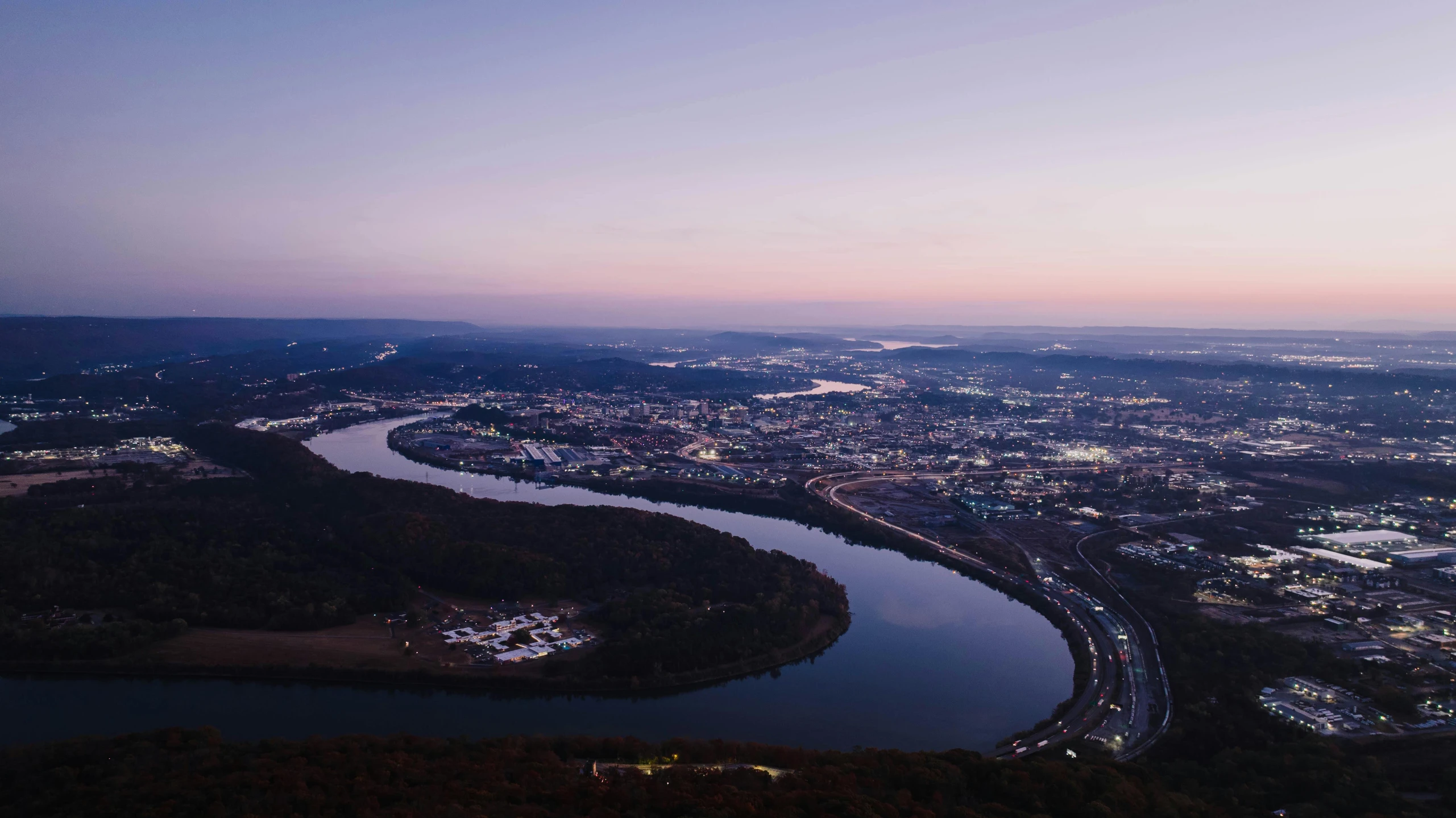 this aerial po is taken at dusk over a city