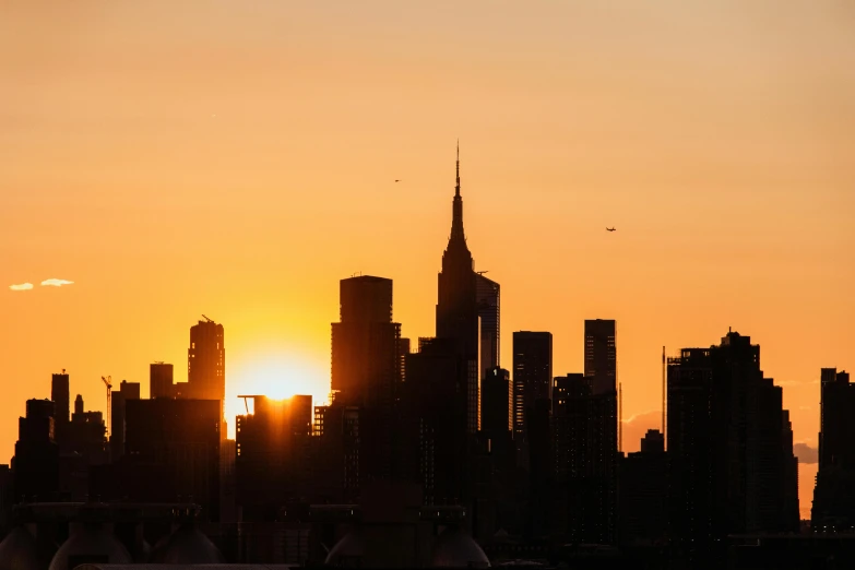 the sun sets over an upscale city area