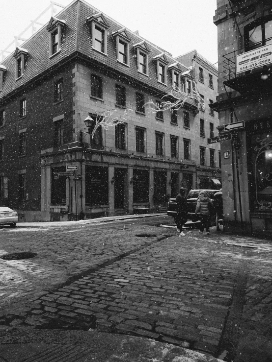 a black and white po of a street during the snow