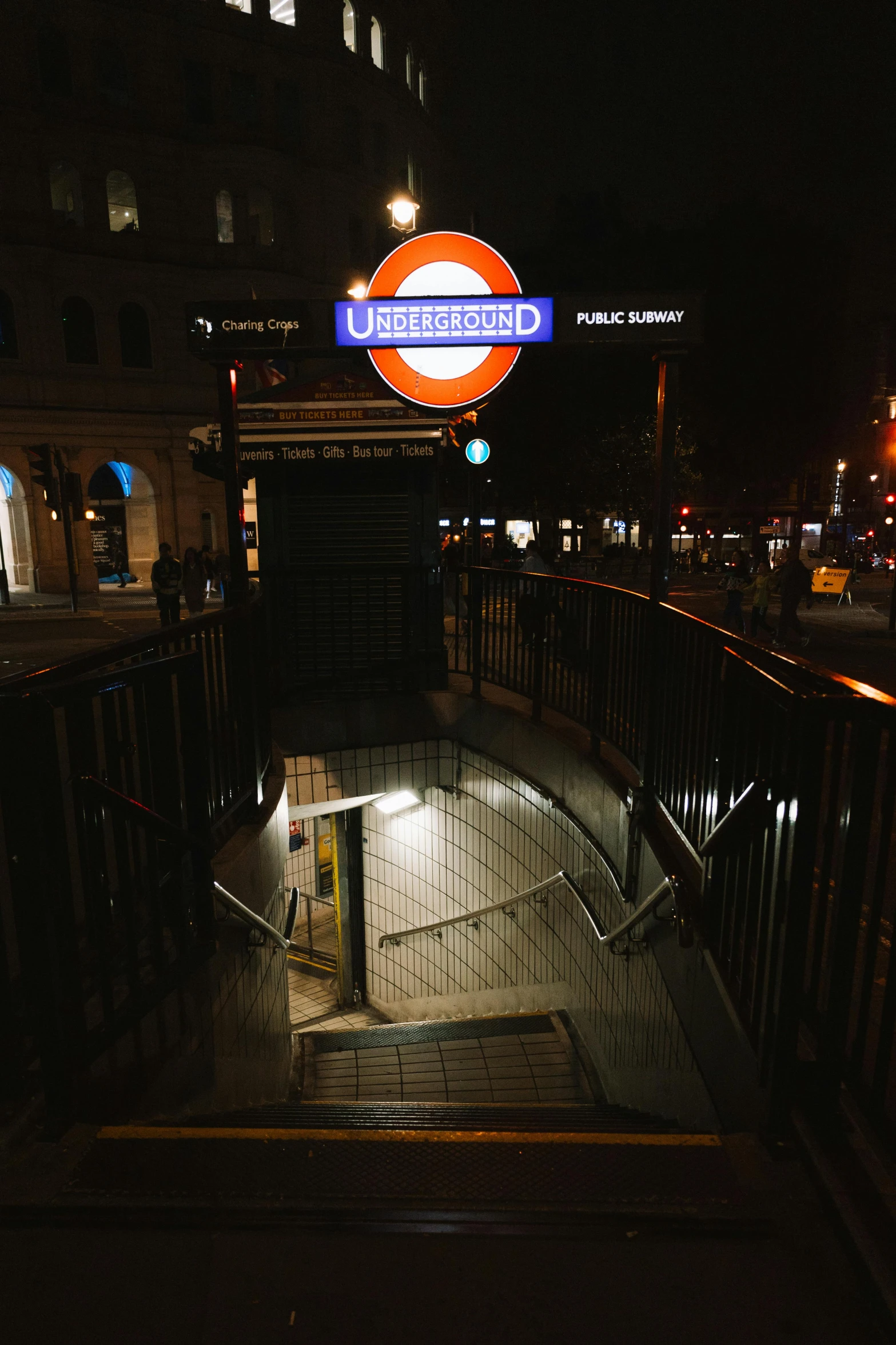 a view of a subway entrance at night