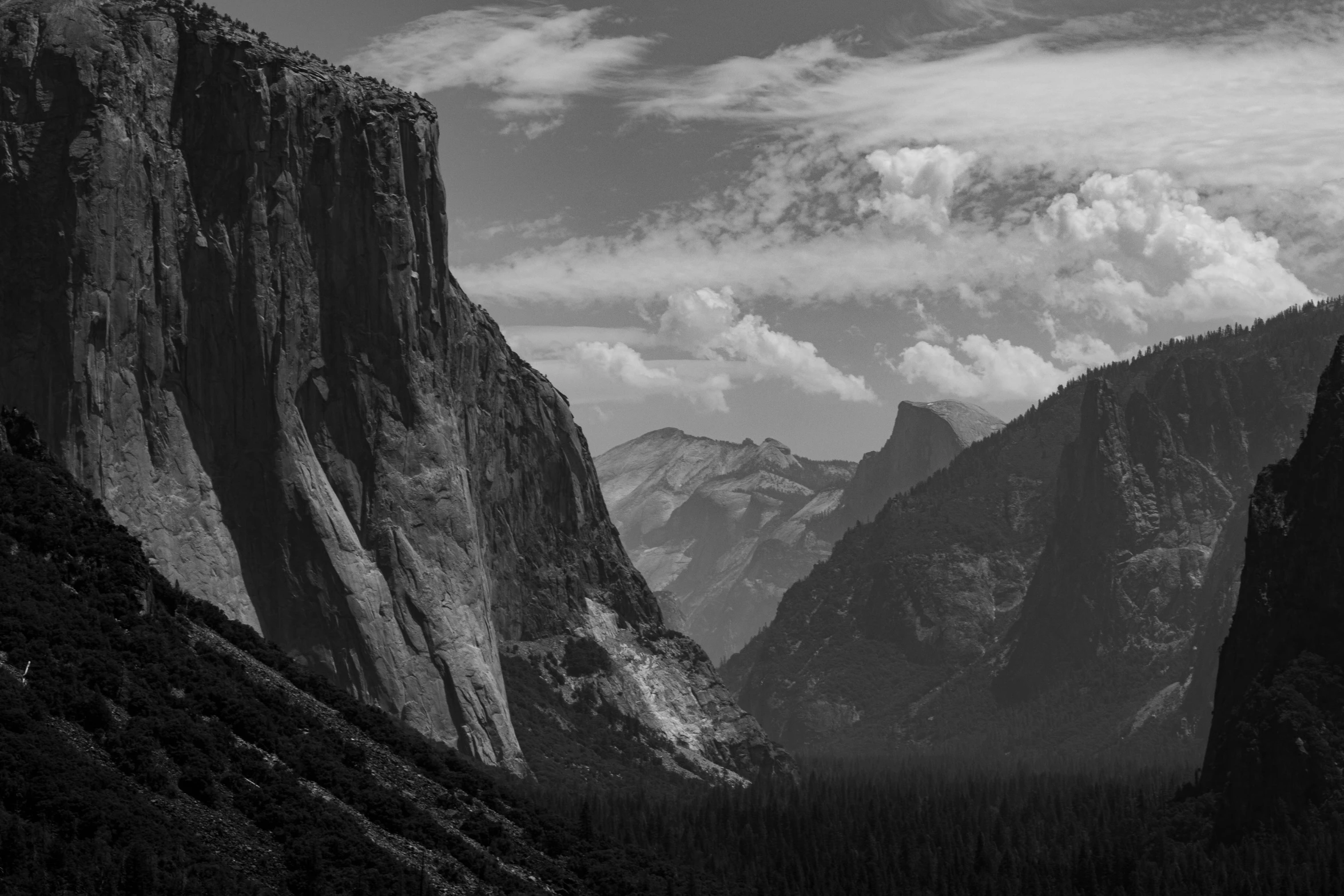 a black and white po of mountains in yosemite