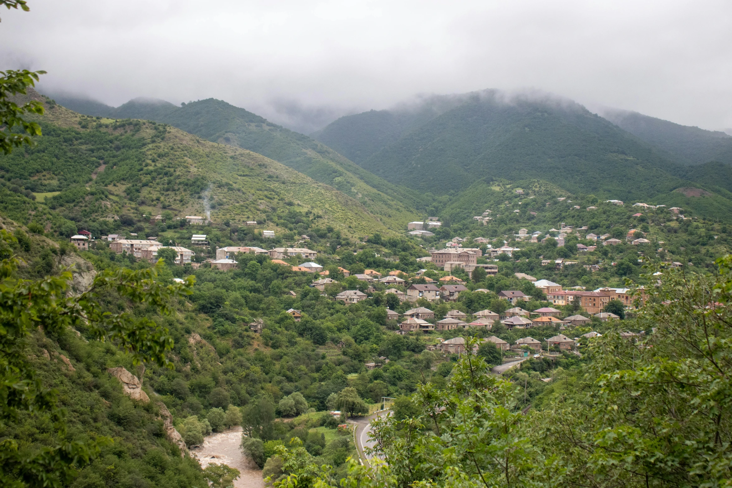 the city is nestled on a mountain overlooking a small valley