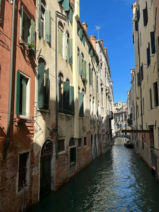 a river flowing between buildings in a city