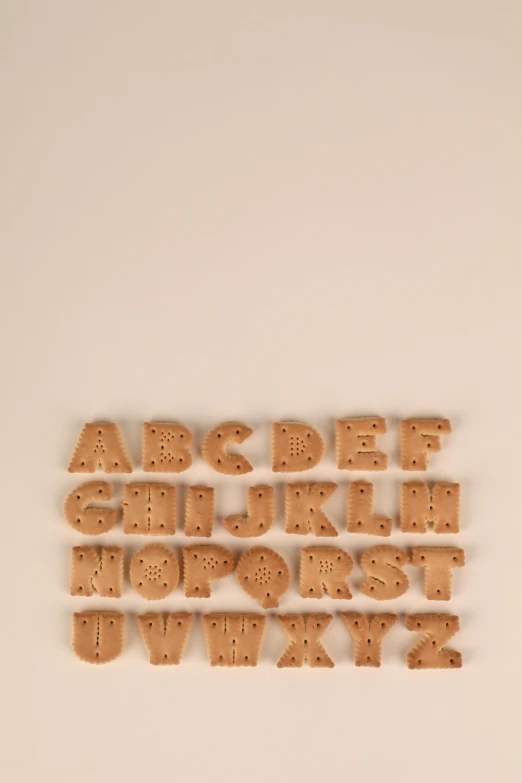 a wooden typeface on the wall by itself