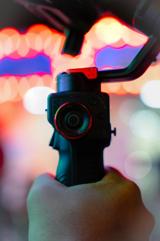 a person holding up a camera inside their car