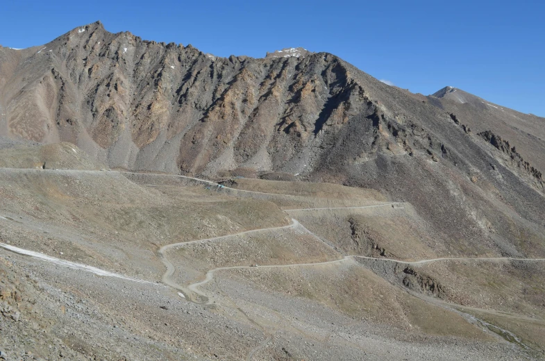 a mountain with many steep peaks on one side