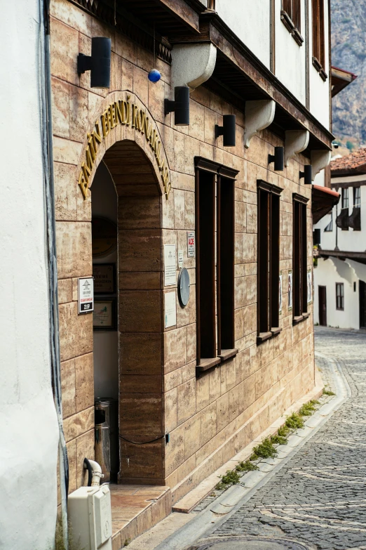 a stone building with arched windows and a doorway