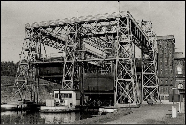 an old po of a steel beam bridge going across water