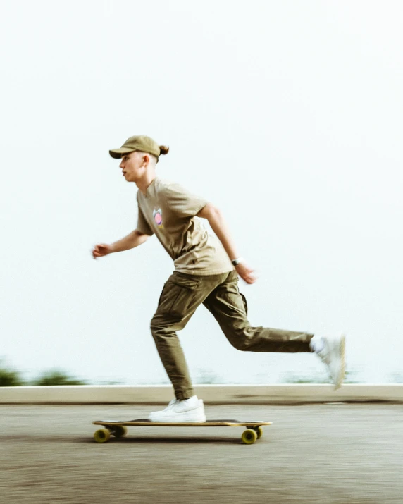 a man riding a skateboard down a street