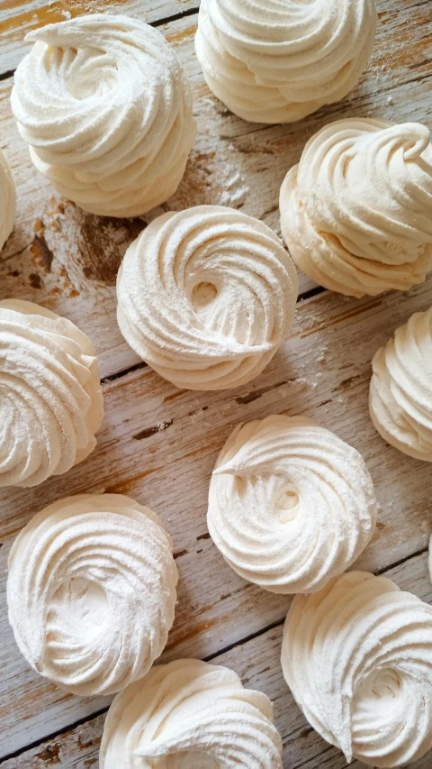 a white table covered with pieces of meringue