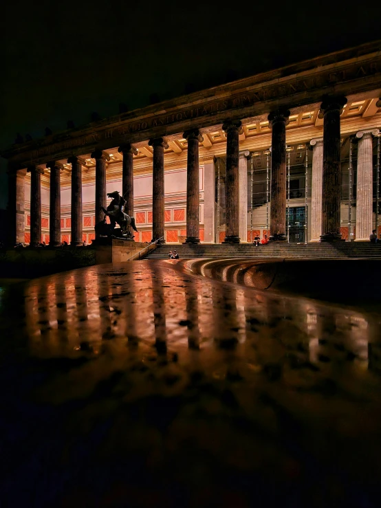 a building with columns and some lights