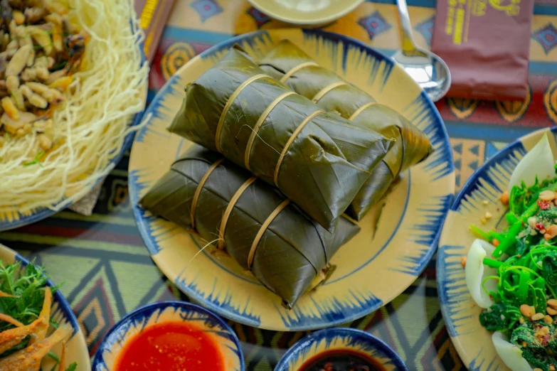 a plate with some vegetables wrapped in paper