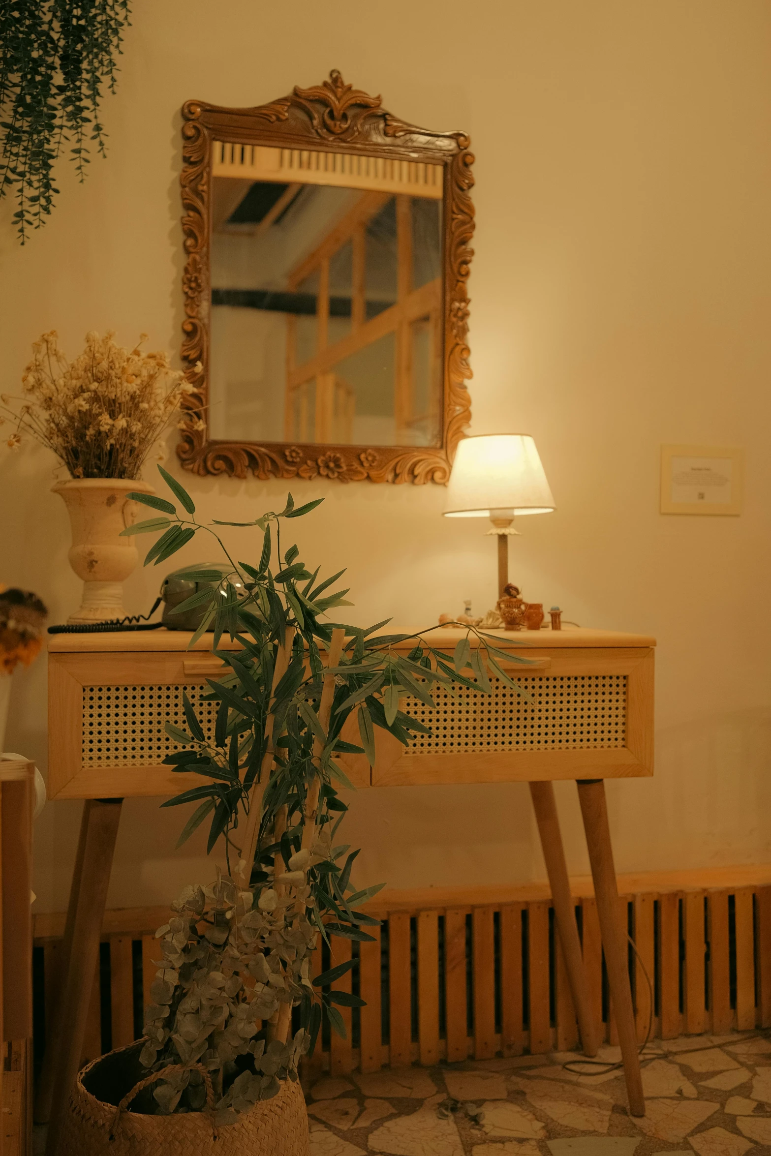 a large mirror hanging over a wooden table