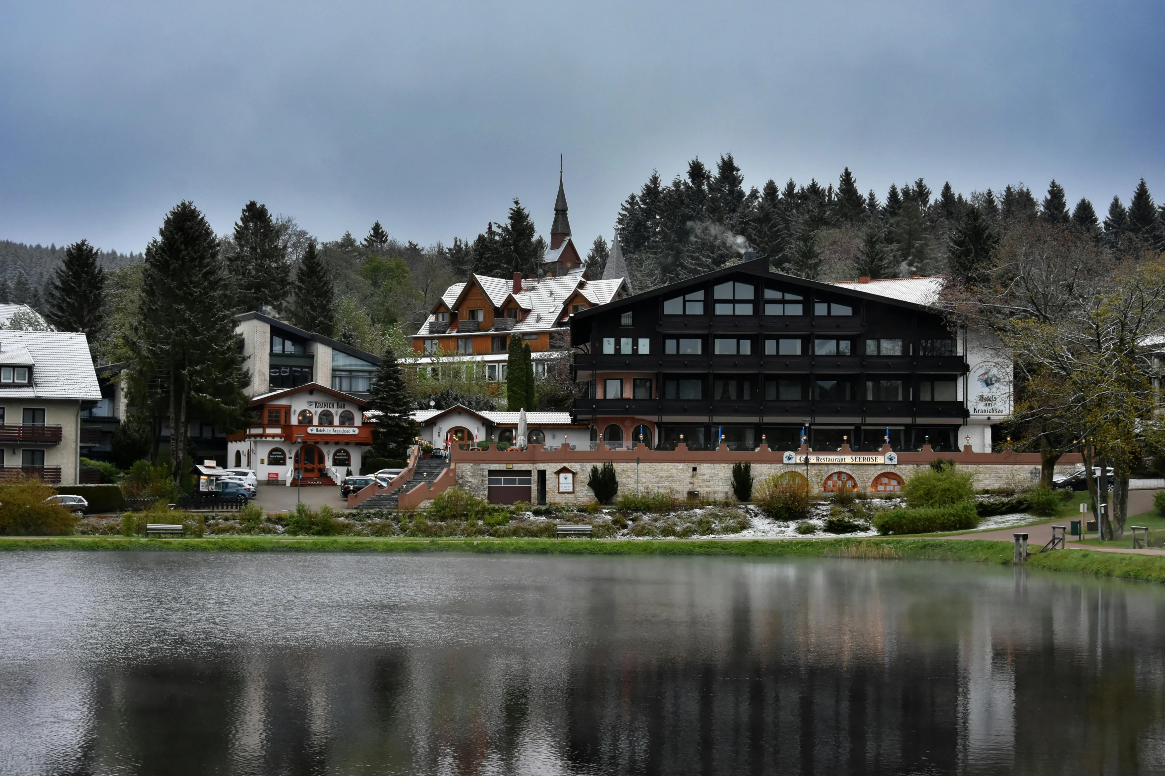 a town by the water under a cloudy sky