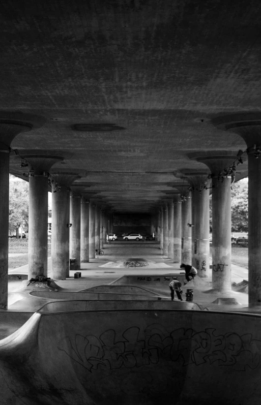 some s are playing inside of an underpass