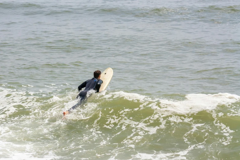 a surfer riding the waves on the ocean