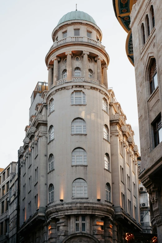 a tall tower like building that is surrounded by other buildings