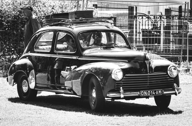 the back end of an old style car in a black and white po