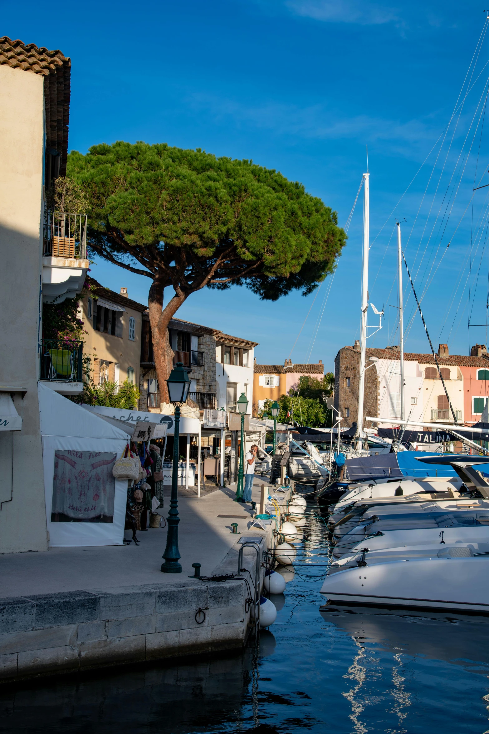 a group of boats docked at a pier