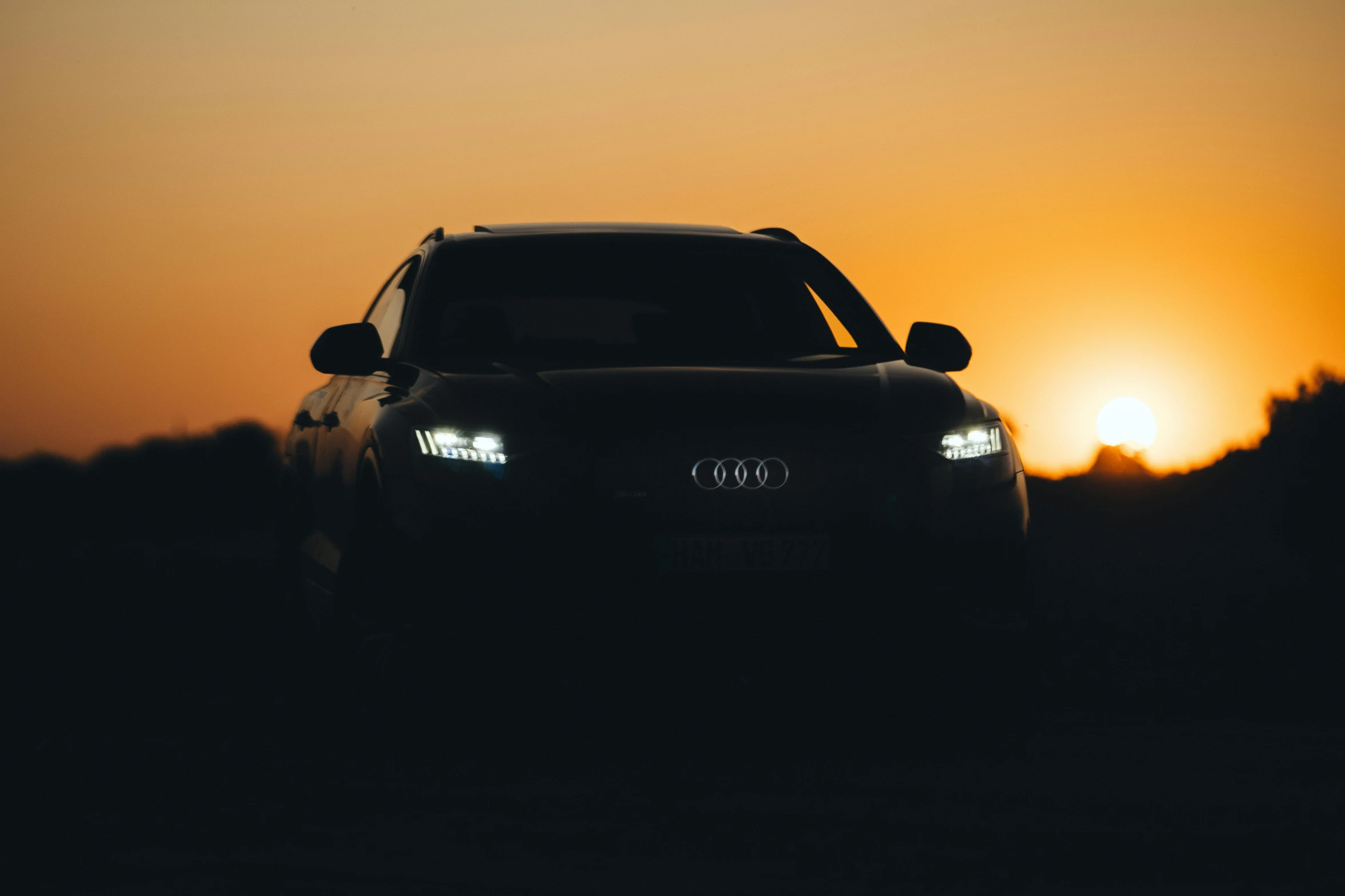 a car driving down a road at night