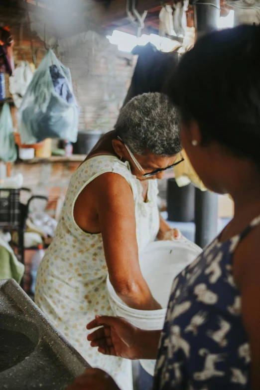 the woman is working on the pottery in her workshop