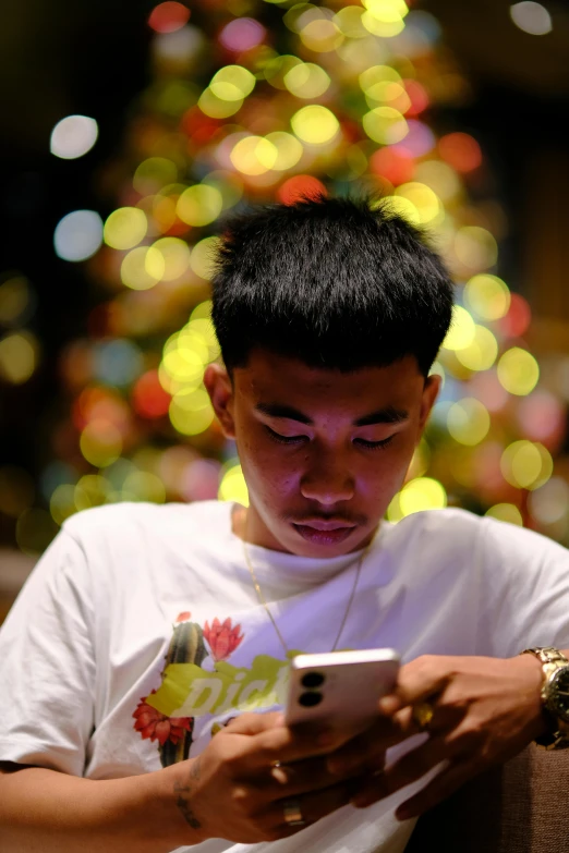 a young man looking at his cell phone