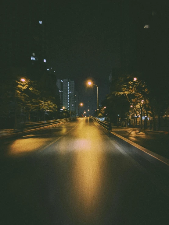 a city street with lights in the dark at night