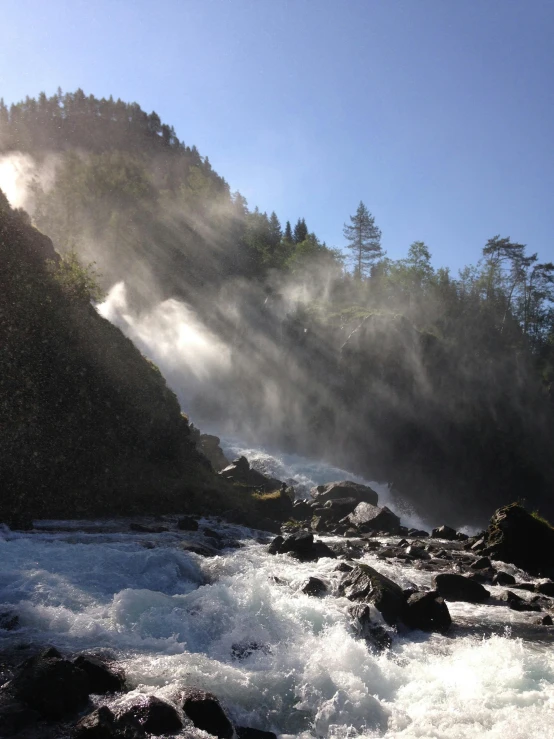 water spraying up from the river, on a mountain