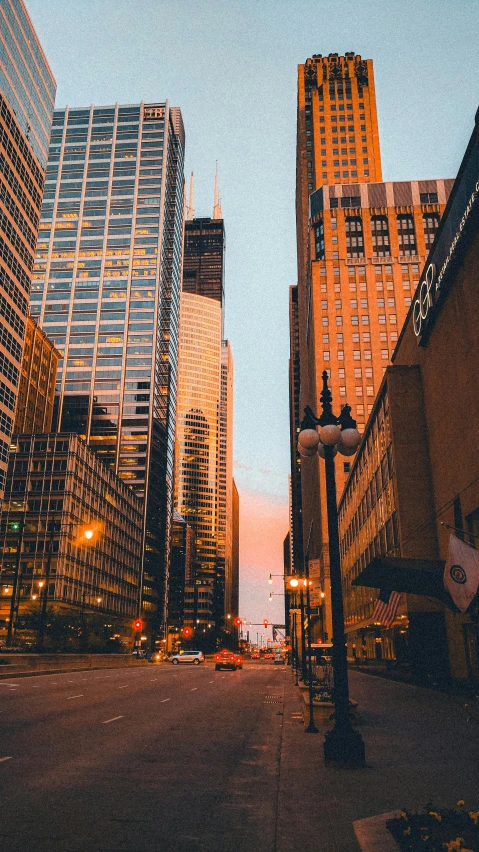 tall skyscrs towering in the city at sunset