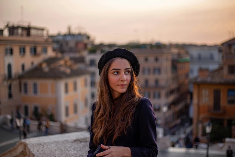 a girl is standing in the middle of a rooftop