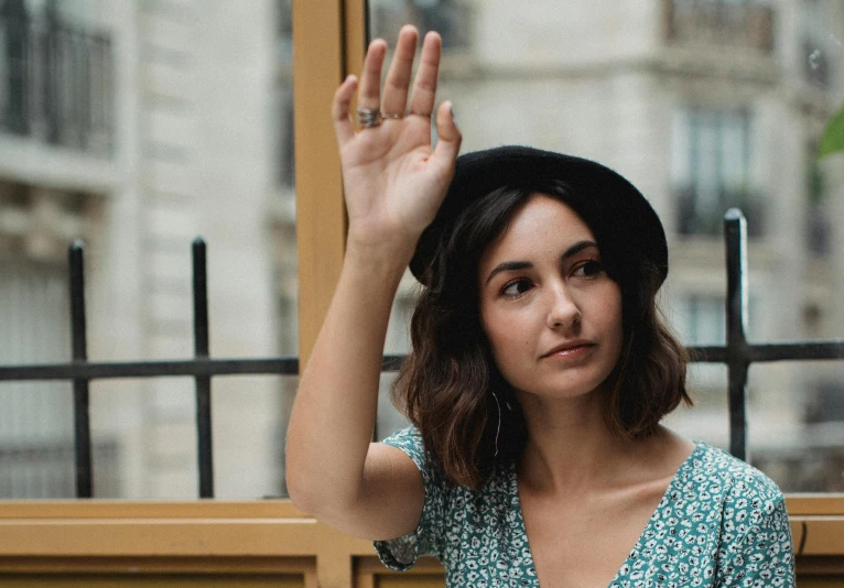 an image of a lady that is waving her hand