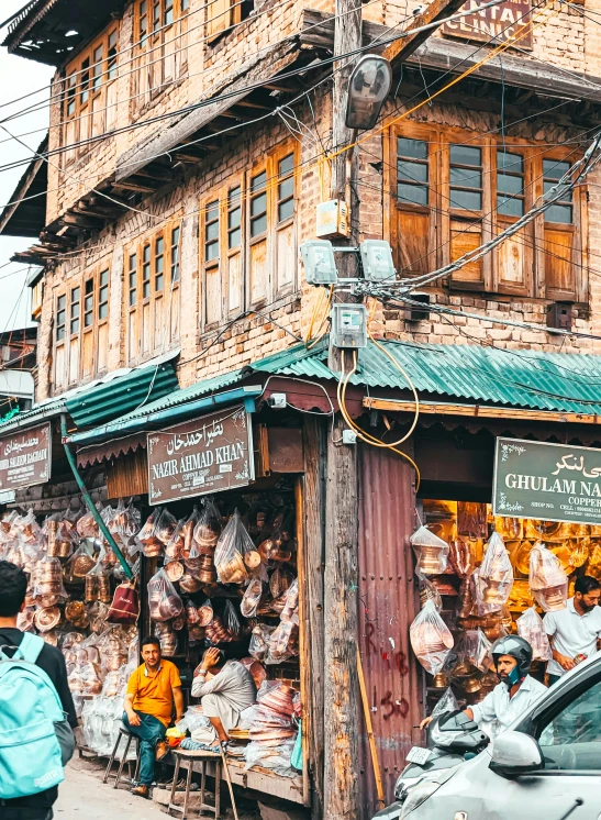 there is a food market on a narrow street