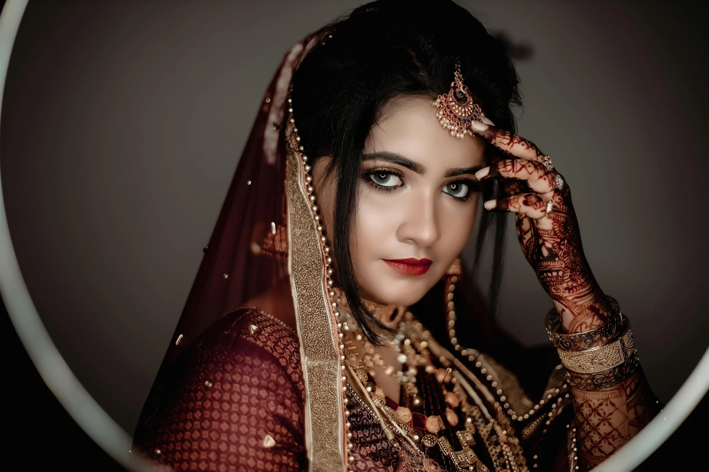 the girl is wearing a veil and posing for a po