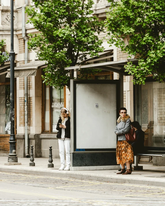 a pair of people that are standing in the street