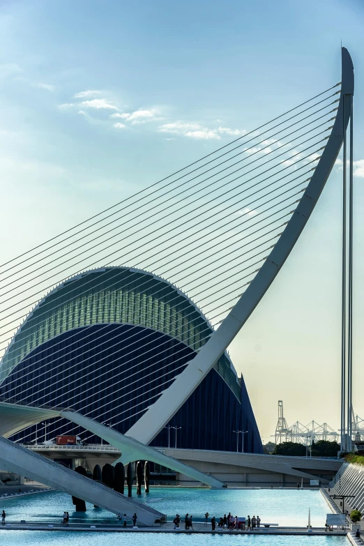 a building with huge, angular lines next to the water