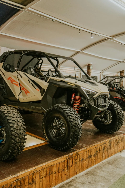 several vehicles on display at a rally