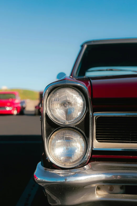 a close up of an old fashioned front light of a car