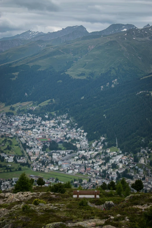 view of small town with mountains and valley in the distance