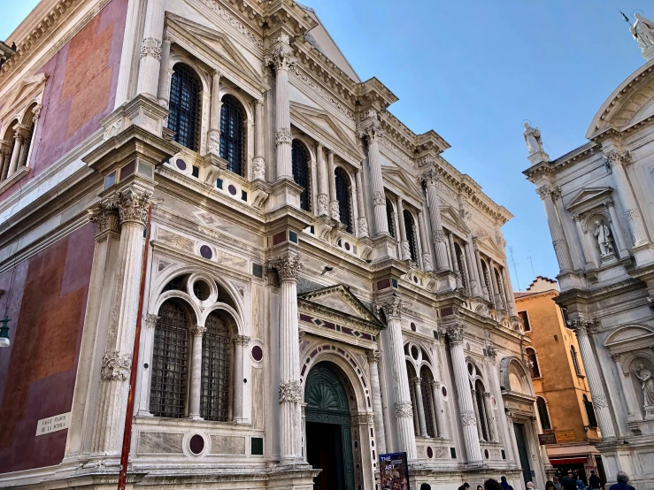 an ornate building with lots of windows on the side