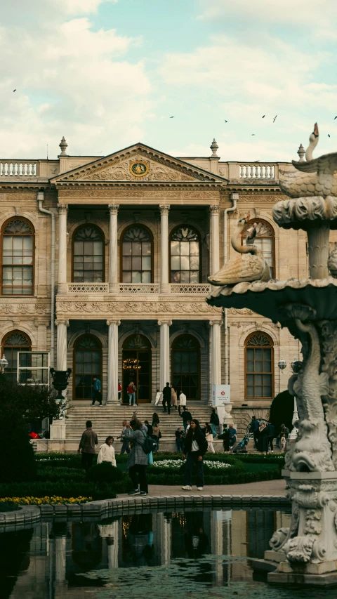 several people standing in front of an old building