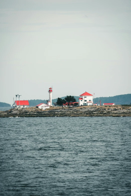 the house next to the lighthouse looks like it's in the middle of nowhere