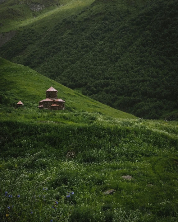 there are some huts at the top of the hill