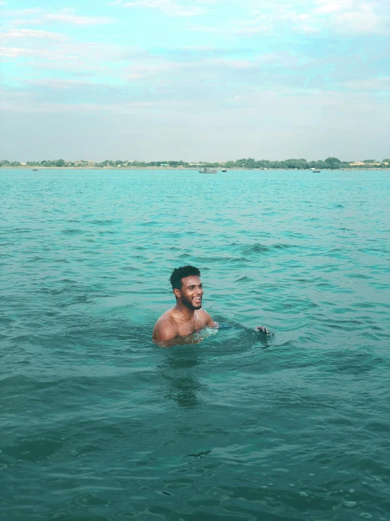 a man in the middle of a body of water