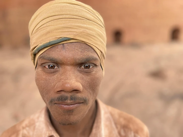 an african man with a turban on his head