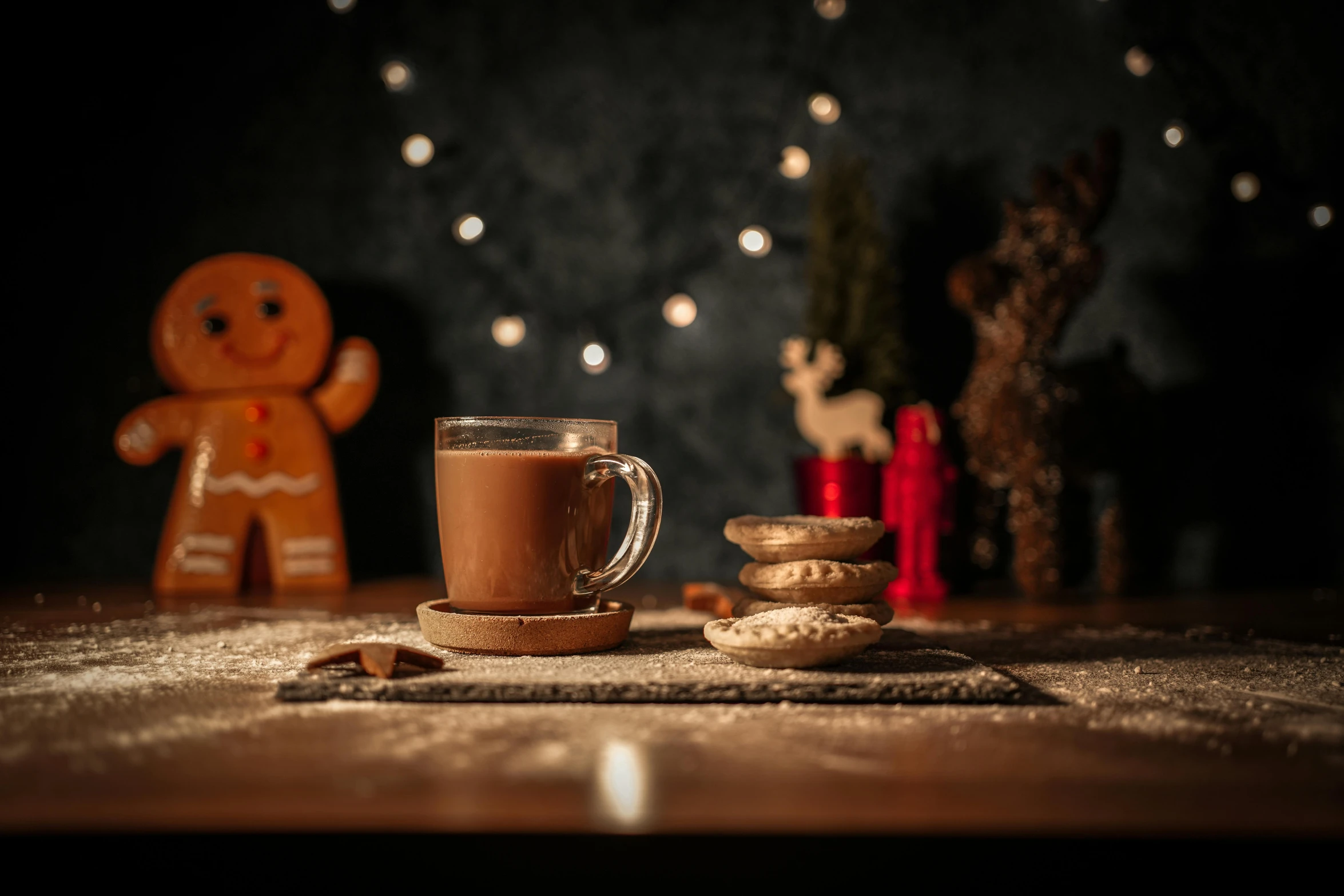 a cup of coffee and two ginger cookies