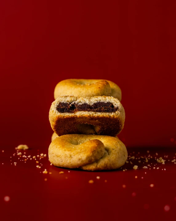 two small biscuits on a red background