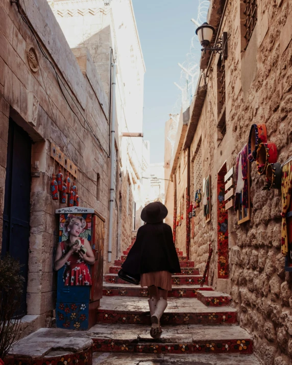 a woman walking down a set of stairs