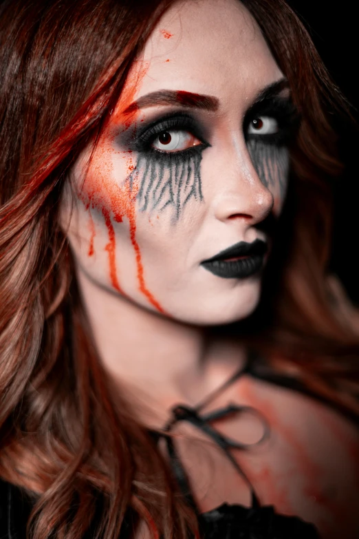 woman with dark make up and makeup on