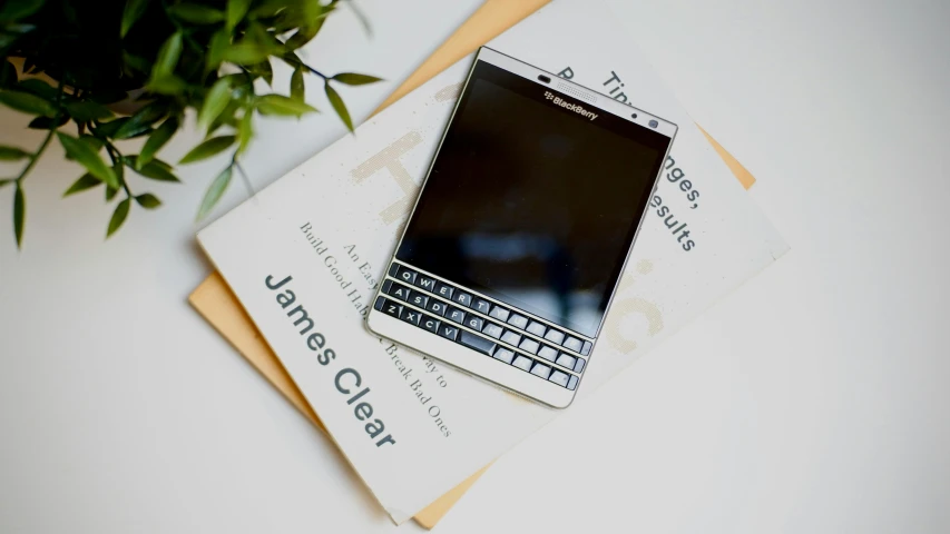 a cell phone on a set of three business cards