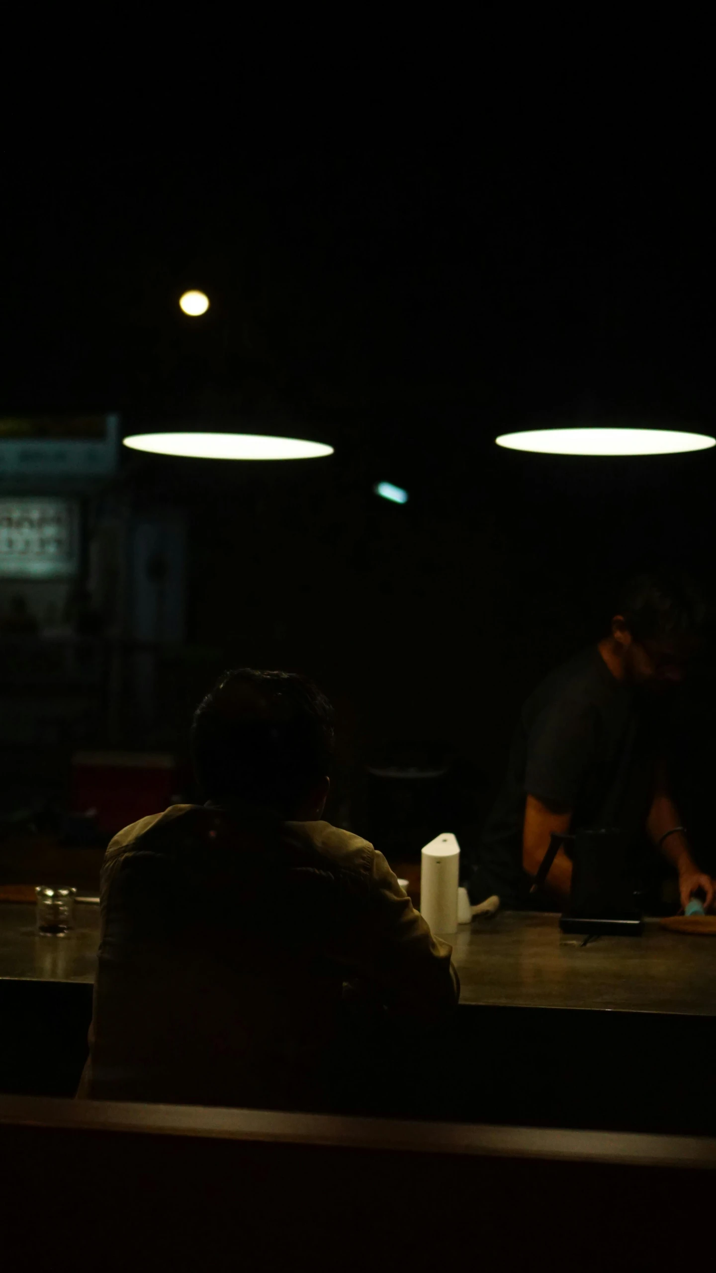 there is a man and a woman sitting at the table